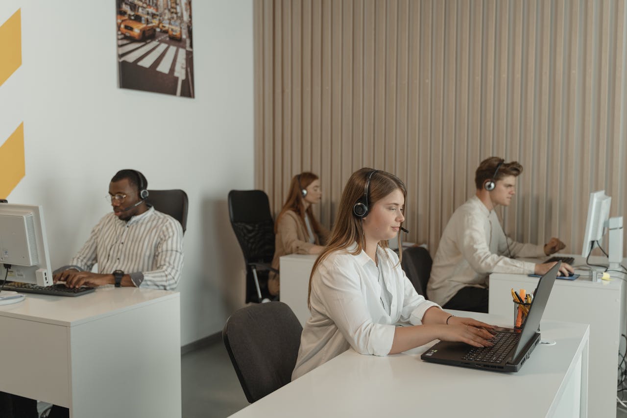 who-we-are Office scene with call center employees at work, focusing on teamwork and productivity.