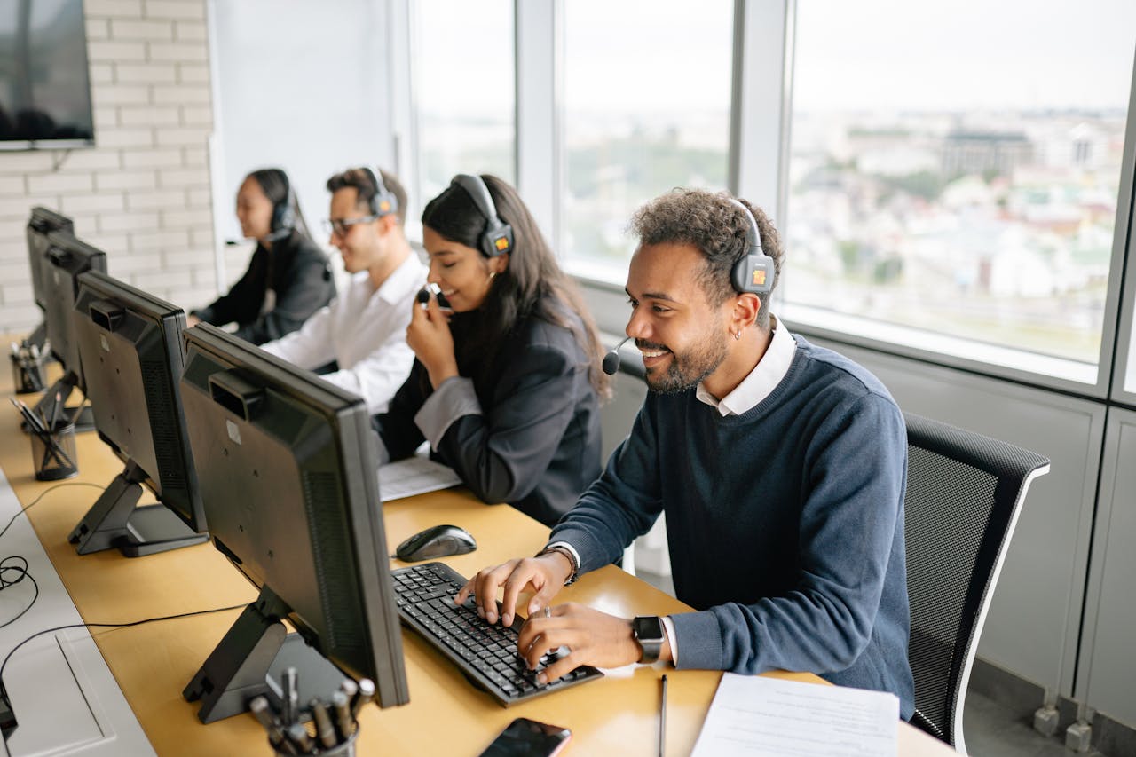 services-03 A diverse team of call center agents working together in an office setting.